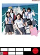 A group of girls in school uniforms standing on a pier.