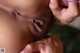 A close up of a black woman's butt with her hands on her face.