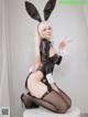 A woman in a bunny costume posing for a picture.